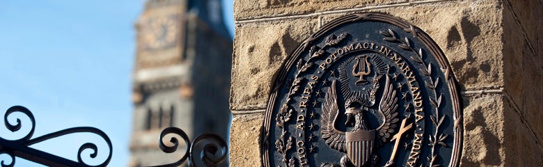 Close-up of the Georgetown University seal on the front gates of the school